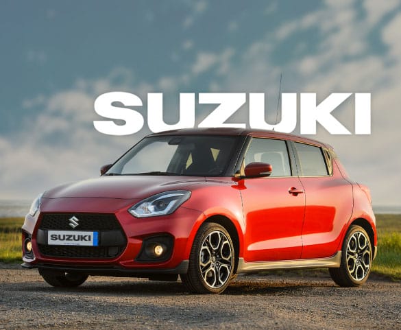 A red Suzuki car is parked on a gravel path with a backdrop of a cloudy sky. The brand name "SUZUKI" is prominently displayed in large white letters across the top of the image, ideal for showcasing in any professional video production.