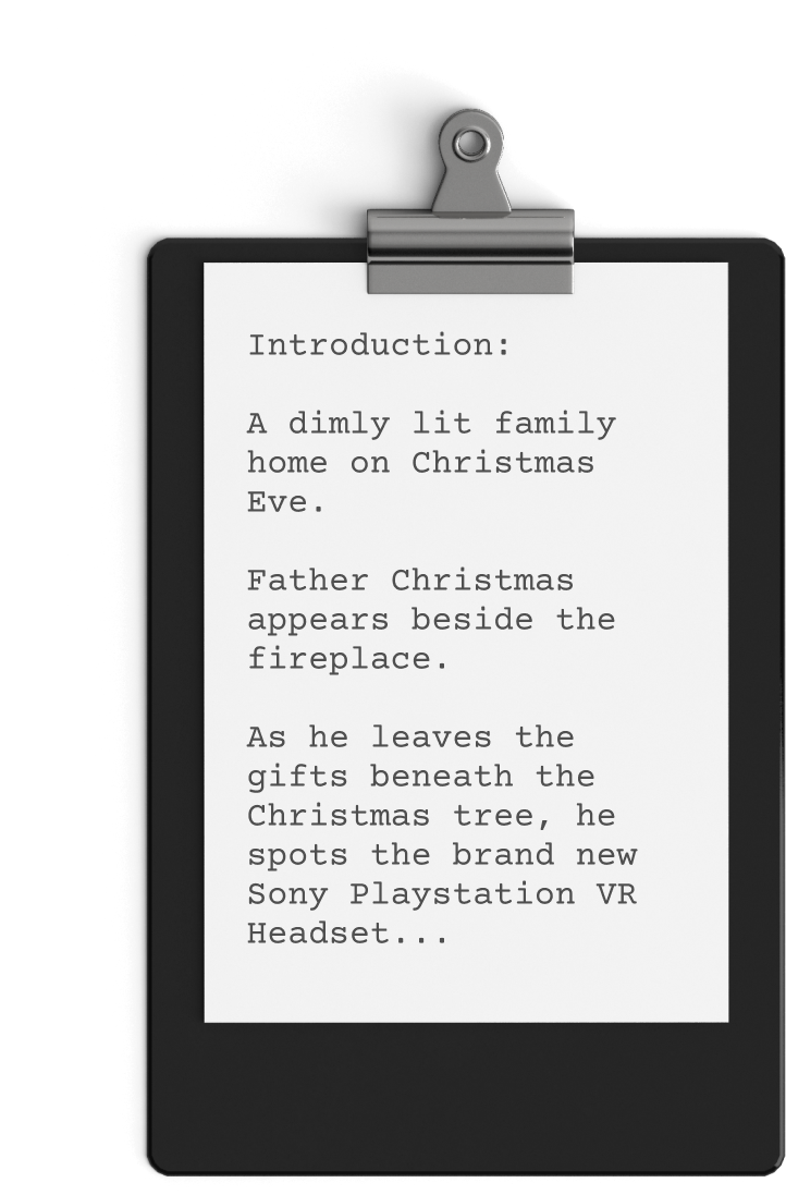 A clipboard holds a typed page that reads: "Introduction: A dimly lit family home on Christmas Eve. Father Christmas appears beside the fireplace. As he leaves the gifts beneath the Christmas tree, he spots the brand new Sony Playstation VR Headset, perfect for their next video game marathon...