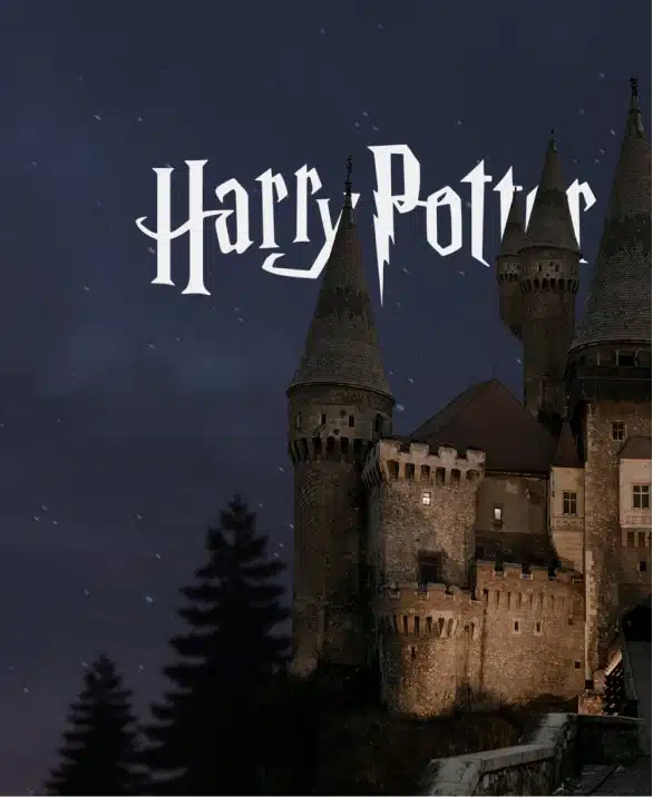 An image featuring a dark, moody night sky with the silhouette of a castle illuminated by a soft light below. The iconic "Harry Potter" logo is prominently placed above the castle, reminiscent of a magical promotional video. Trees are silhouetted against the night sky at the base of the castle.
