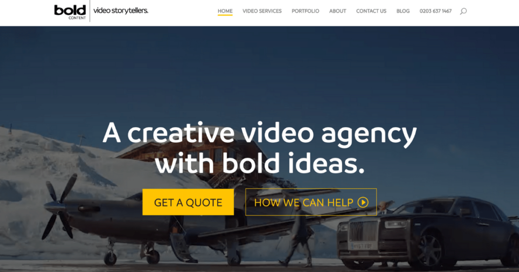 Screenshot Of The Homepage Of Bold Content, A Video Agency Named Among The Top 10 Video Production Companies. The Page Features A Snowy Mountain Backdrop With An Aircraft And A Luxury Car In The Foreground. Prominent Text Reads, &Quot;A Creative Video Agency With Bold Ideas.&Quot; Buttons For &Quot;Get A Quote&Quot; And &Quot;How We Can Help&Quot; Are Below. Screenshot of the homepage of Bold Content, a video agency named among the top 10 video production companies. The page features a snowy mountain backdrop with an aircraft and a luxury car in the foreground. Prominent text reads, "A creative video agency with bold ideas." Buttons for "Get a Quote" and "How We Can Help" are below.