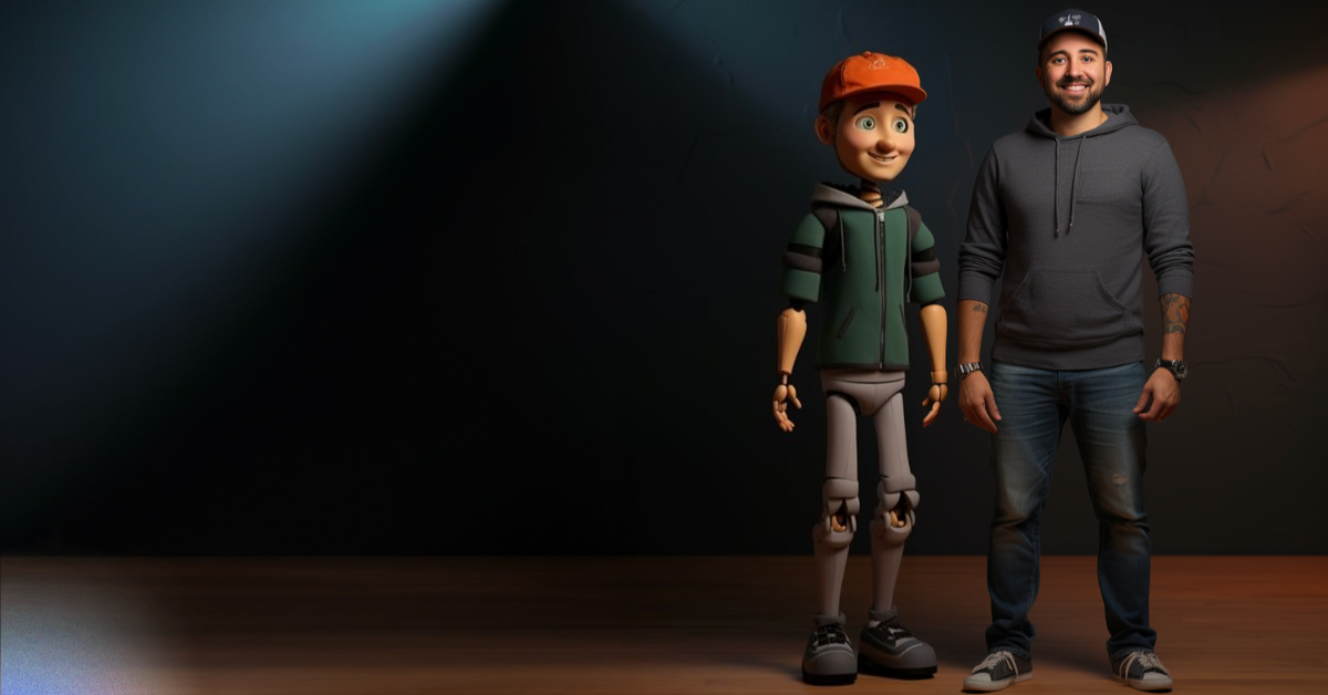 A photograph featuring a tall, animated character in a green hoodie, gray pants, and an orange cap stands beside a smiling man in a gray hoodie, jeans, and a hat. The background is dark with spotlights highlighting them, giving it an Animation vs Live-Action feel.