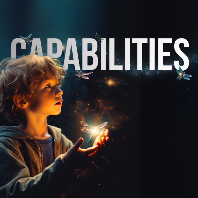 A young child with curly hair gazes in awe at glowing dragonflies he holds near his chest. The scene is illuminated by a soft light, creating a mystical atmosphere. The word "CAPABILITIES" is prominently displayed above the child in large letters.