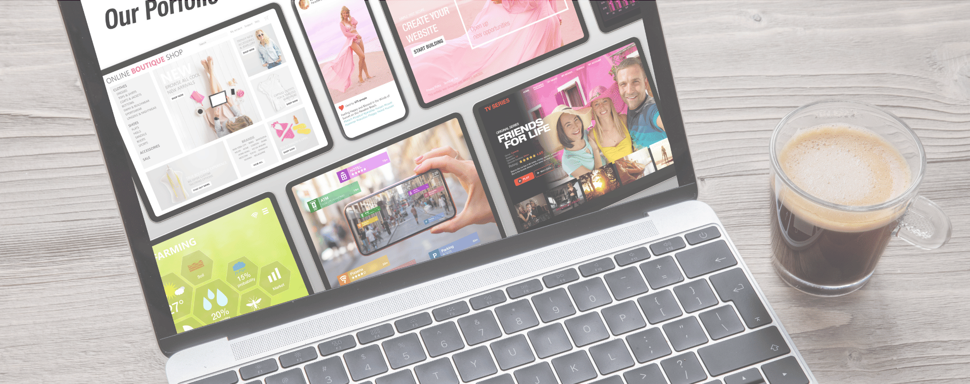 A laptop displaying a portfolio with multiple colorful project thumbnails on its screen is open on a wooden surface next to a glass cup of coffee. The thumbnails, including an engaging homepage video and explainer video, feature a variety of designs and images, suggesting diverse creative work.